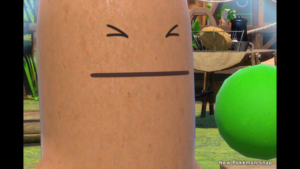 Screenshot from New Pokemon Snap. A close-up of a Sudowoodo, a tree-like Pokemon, making a strained expression. 