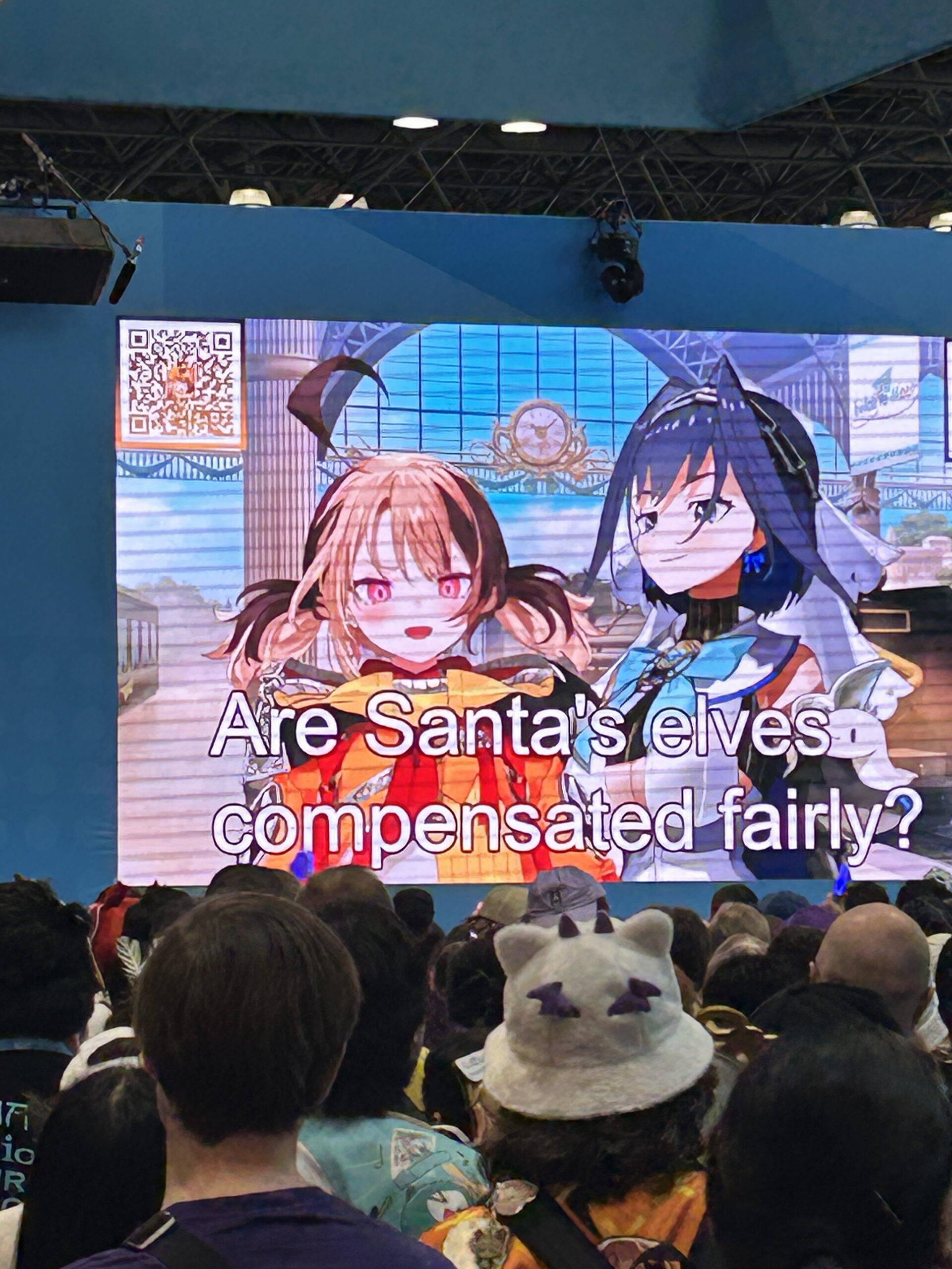 Ouro Kronii and Gigi Murin from Hololive discussing whether Santa's elves are compensated fairly